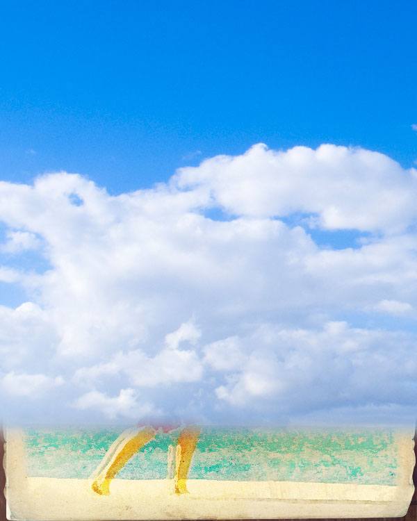 worn vintage beach ad in photoshop