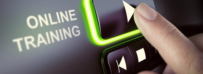 Finger pressing a push button to start playing a tutorial.