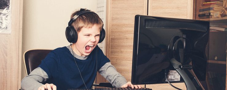 Kid playing on computer