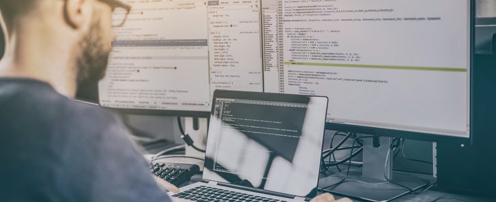 Developing programming and coding technologies. Website design. Programmer working in a software develop company office.