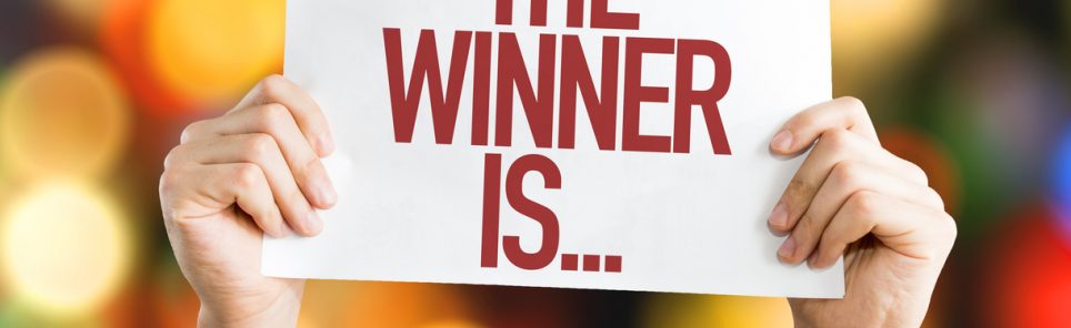 The Winner Is... placard with bokeh background