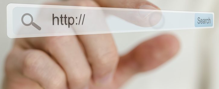 Business man hand pointing at search bar on virtual screen.