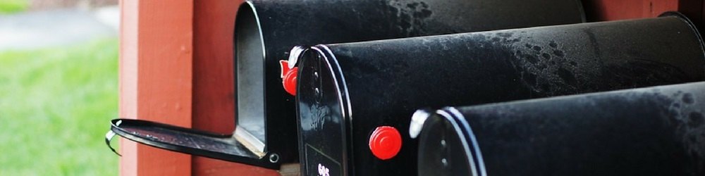 three black mailboxes