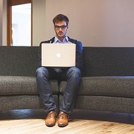 man on apple laptop