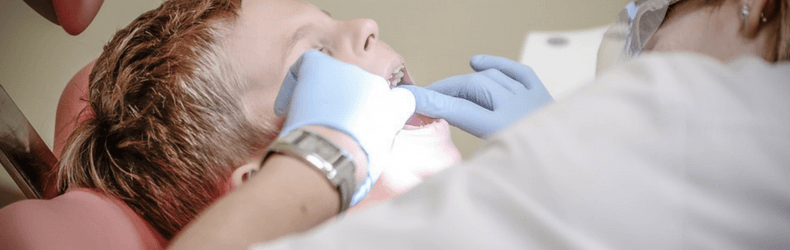 dentist working with child