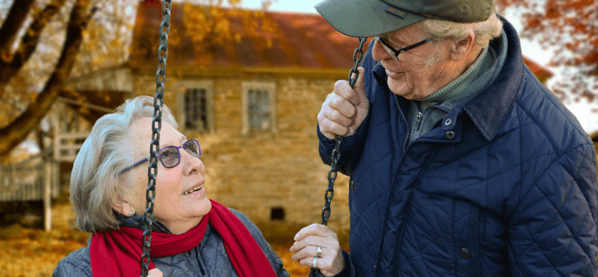 Two elderly people outdoors together