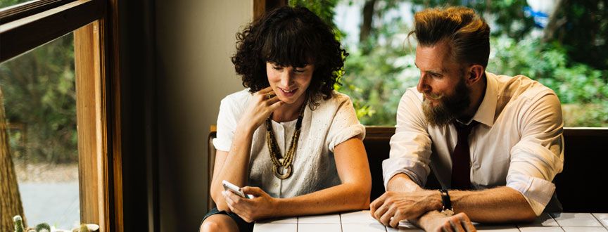 two people meeting at a table