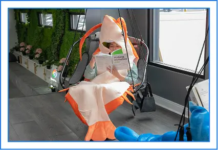 FXer reading in a fish costume