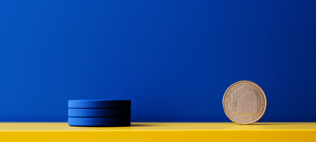 Coin standing up on a yellow table