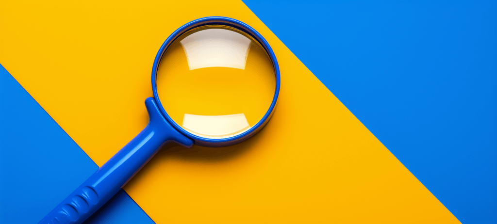 Blue magnifying glass on a blue and yellow striped background