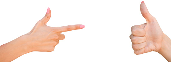 Two hands against a white background, one making a thumbs-up gesture and the other pointing with the index finger.