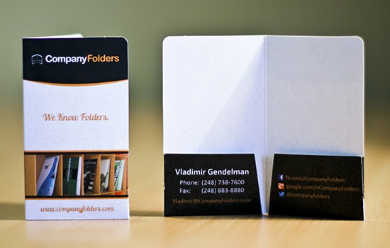 Two business cards for 'Company Folders' with one showing the company logo, tagline, and website, and the other displaying contact information for Vladimir Gendelman, including phone, fax, email, and social media links.