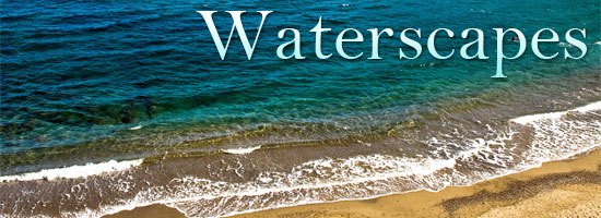 A serene beach scene with gentle waves washing onto the sandy shore under the word 'Waterscapes'.