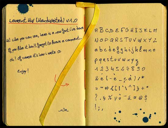 Open notebook displaying a handwritten font sample called 'Laurent Hu (Handwritten) v1.0'. The left page contains a message about the font and the right page shows the alphabet, numbers, and punctuation in the handwritten style, with a yellow ribbon bookmark and ink splatters.