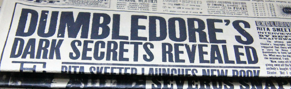 Close-up of a newspaper headline reading 'DUMBLEDORE'S DARK SECRETS REVEALED' with a subheading 'Rita Skeeter Launches New Book.'