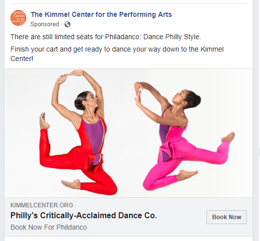 Two dancers in red and pink attire performing a jump with graceful poses, promoting Philadanco at the Kimmel Center for the Performing Arts.