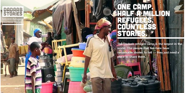 A market scene at Dadaab refugee camp with a man walking past stalls selling household goods, accompanied by text highlighting the camp as the largest in the world with half a million refugees and countless stories.