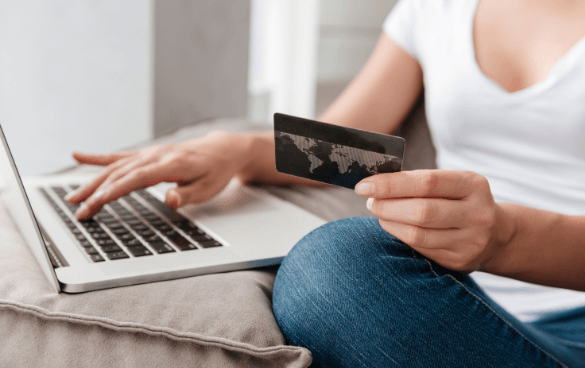 Person shopping online with a credit card