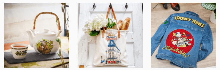 A floral teapot and cups set, a tote bag with a building print filled with flowers and a baguette, and a denim jacket with a Looney Tunes patch on the back.