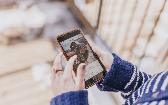 Girl browsing on Instagram on her phone