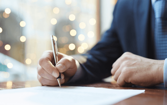 Man writing on a piece of paper