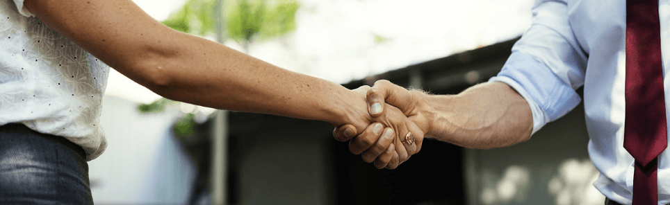 a person earns a new lead with a handshake