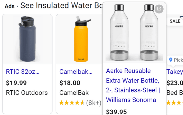 A selection of insulated water bottles with prices and ratings, including a blue RTIC bottle, a yellow CamelBak bottle, two stainless-steel Aarke bottles from Williams Sonoma, and a Takeya bottle on sale.