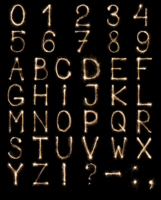 Full english alphabet and numbers set made from burning sparkles on black background. Shiny festive firework latin font.