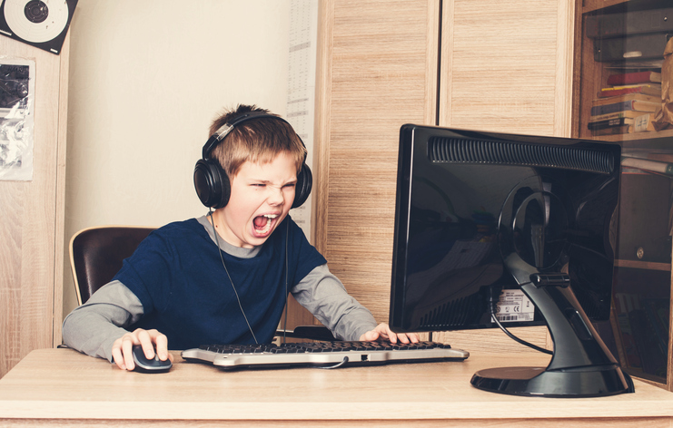 Kid playing on computer