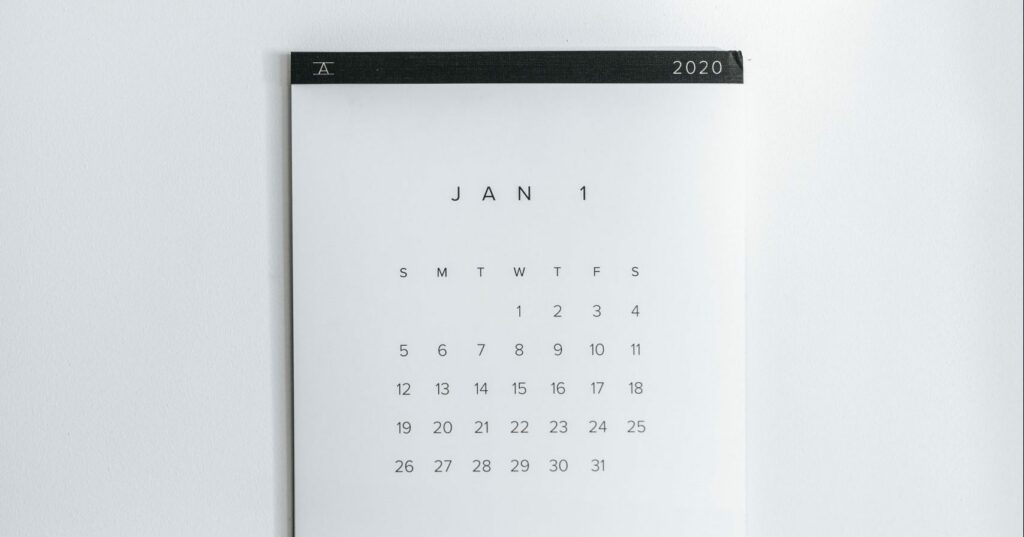 A minimalistic January 2020 calendar on a white wall, with days of the week from Sunday to Saturday and the 1st starting on a Wednesday.