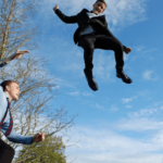 people jumping on trampoline