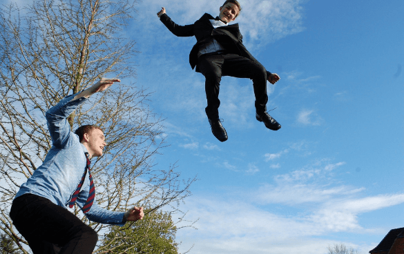 people jumping on trampoline