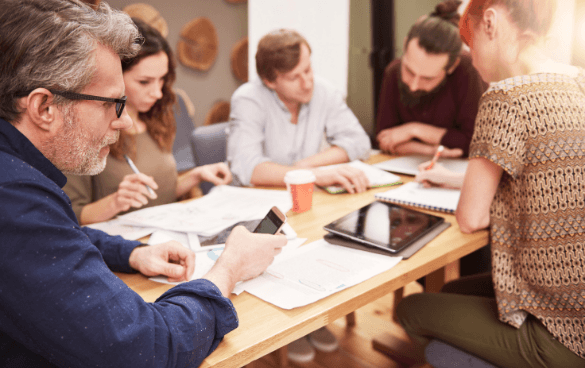 People sitting at a table working together