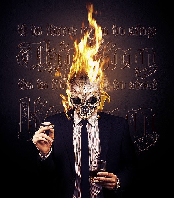 Artistic image of a person with a skull for a head, with flames rising from the top of the skull. The figure is dressed in a suit and tie, holding a cigar in one hand and a glass in the other. Behind the figure is a dark background with ornate golden text.