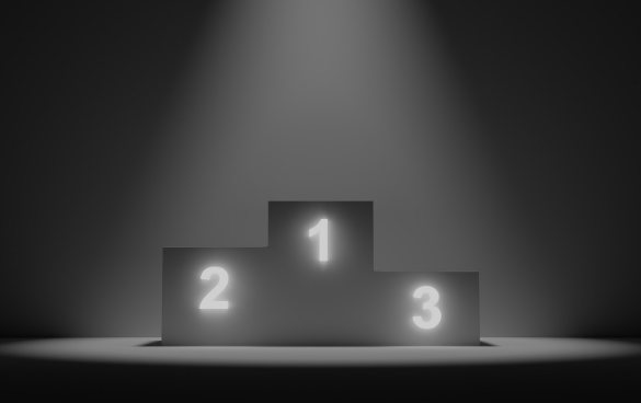 A spotlighted three-tiered podium with the numbers 1, 2, and 3 indicating first, second, and third place respectively, with the focus on the first place.