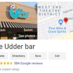 Screenshot of The Udder Bar's Google search result showing a 4.7-star rating, 584 reviews, and a map location near West End Theatre District. The storefront has a sign with a cartoon cow and mentions ice cream and sundaes.