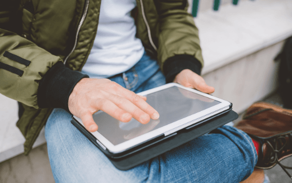 Man browsing on a tablet