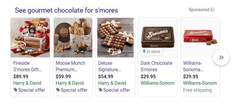 Advertisement showcasing gourmet chocolate products for s'mores including a Fireside S'mores Gift Basket, Moose Munch Premium Popcorn, Deluxe Signature Chocolate Truffles, Dark Chocolate S'mores, and Williams-Sonoma Chocolate Bars with prices ranging from $29.95 to $89.99, some with special offers and free shipping.