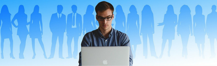 A person with glasses working on a MacBook in the foreground with silhouetted figures of men and women in business attire in the background on a light blue gradient.