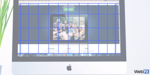 An iMac displaying a webpage with a grid overlay for layout design, featuring a central photo of a group of people, with a blurred plant in the foreground and a 'WebFX' watermark.