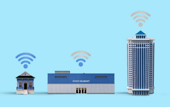 Three buildings with Wi-Fi signals above them, representing different types of structures with internet access: a small house, a medium-sized food market, and a tall skyscraper, all against a blue background.