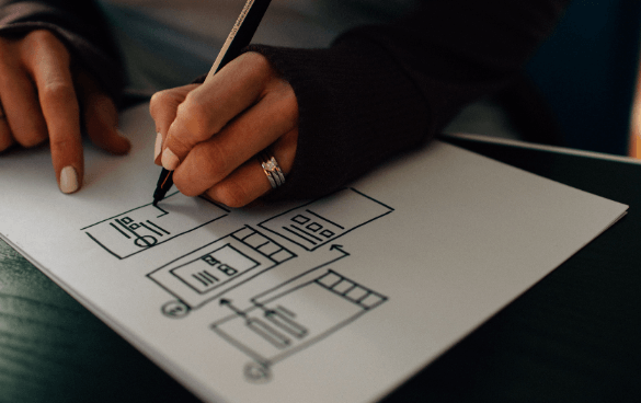 Person drawing a wireframe design