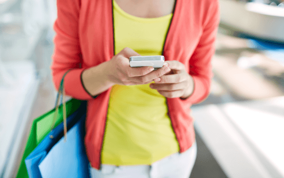 woman browsing online while she shops