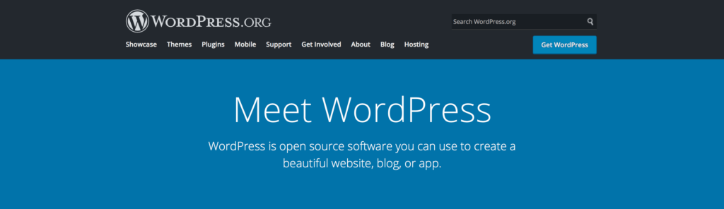 Screenshot of the WordPress.org homepage with navigation menu, search bar, 'Get WordPress' button, and a blue banner with text 'Meet WordPress' and a subtitle about WordPress being open source software.