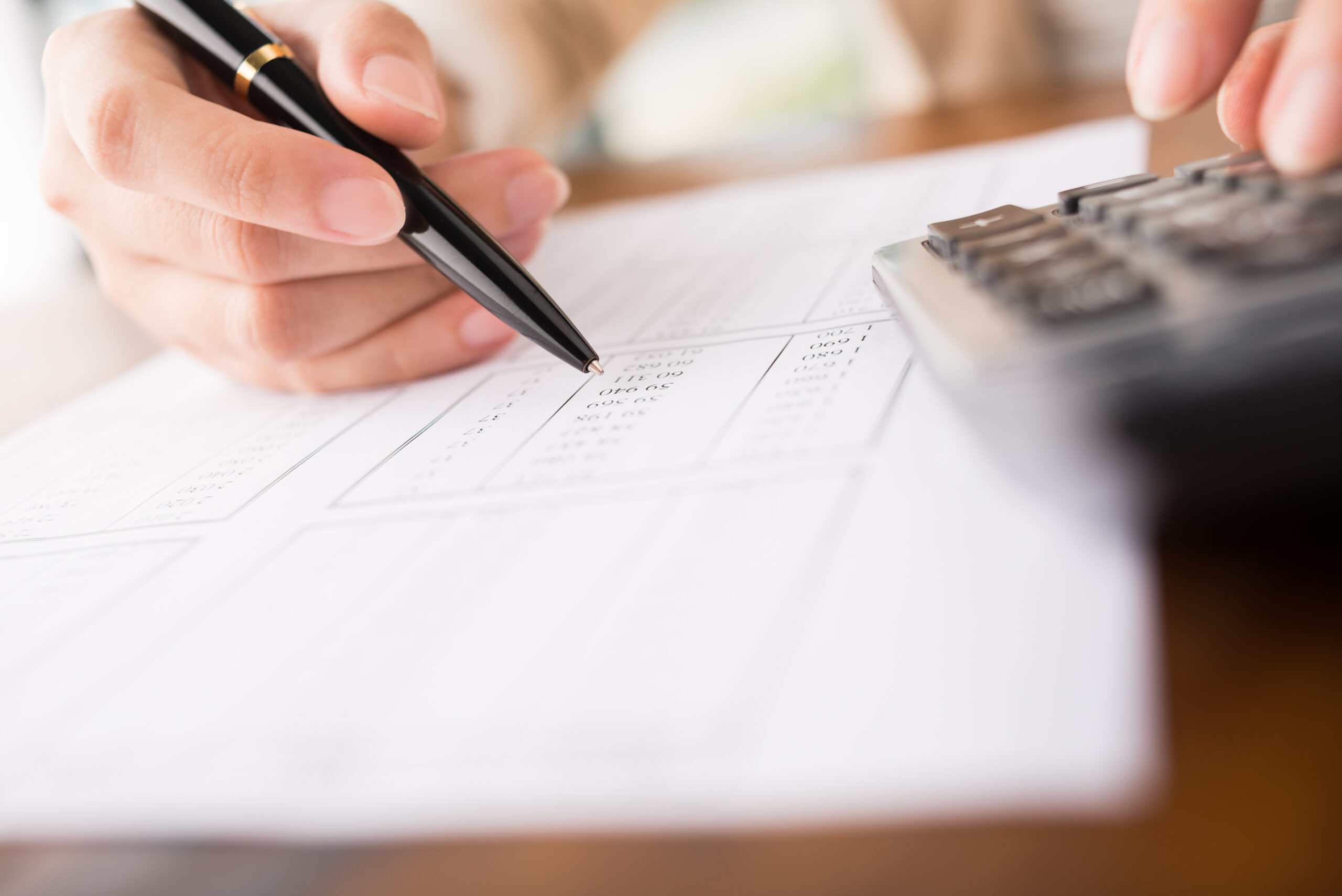 Accountant working with calculator