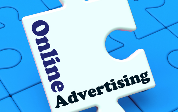 A white puzzle piece with 'Online Advertising' text over a background of blue puzzle pieces.