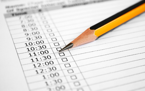 Close-up of an appointment schedule with time slots and a pencil pointing to the 10:30 checkbox.