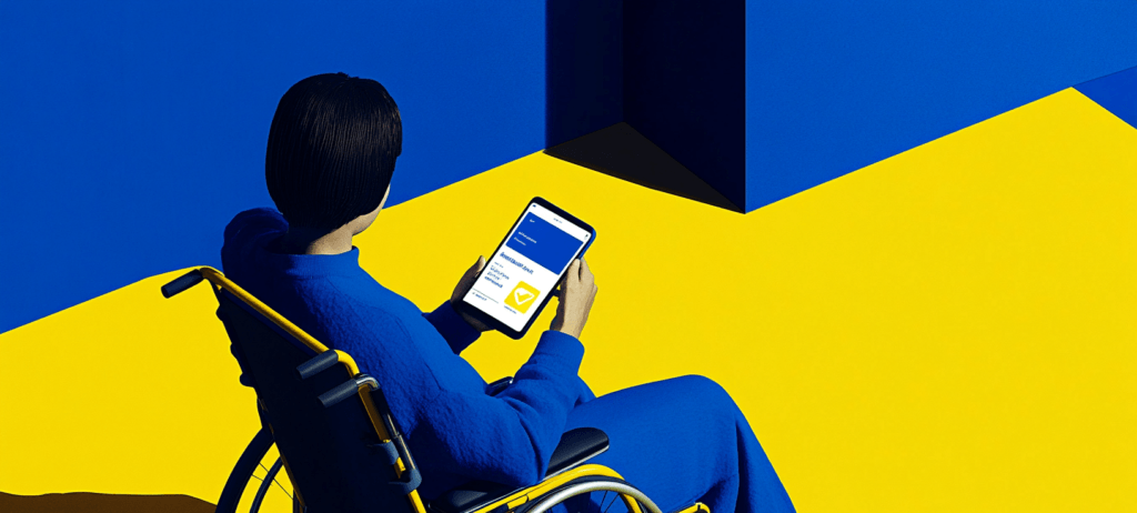 Person in a wheelchair holding a tablet.