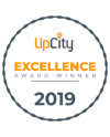 UpCity Excellence Award Winner 2019 badge with a circular orange and white design.