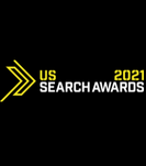 Logo of the US Search Awards 2021 featuring a stylized golden arrow pointing right with text.